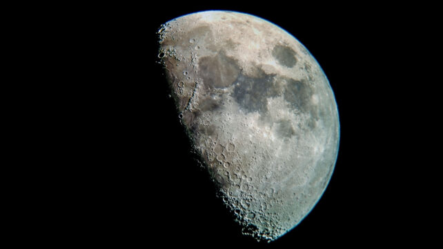 A half moon close up on black