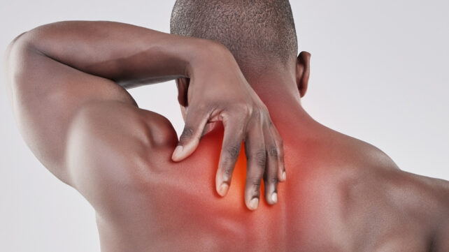 man with sore shoulder muscles