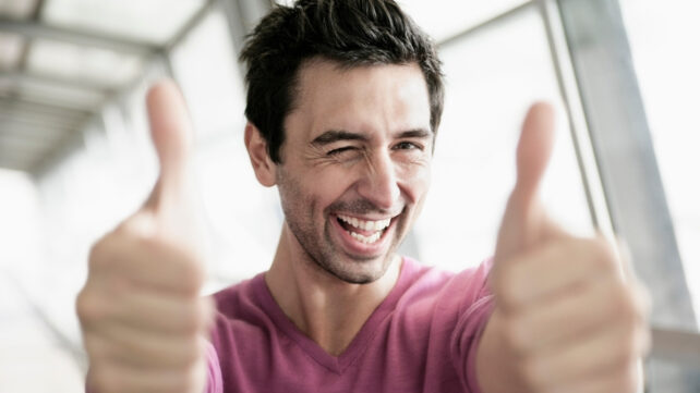 man with two thumbs up