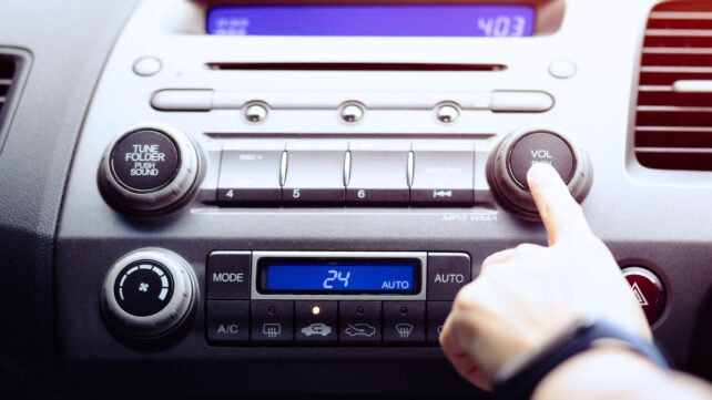 person listening to car radio