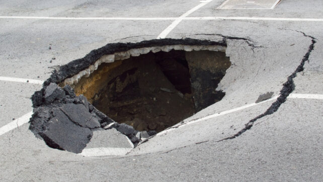 sinkhole in a parking lot